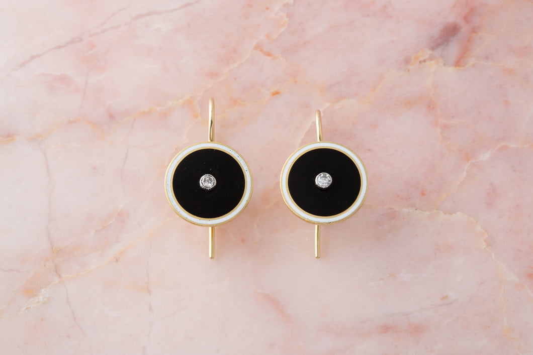 A pair of early 20th century circular black and white enamel diamond earrings by Lacloche Freres