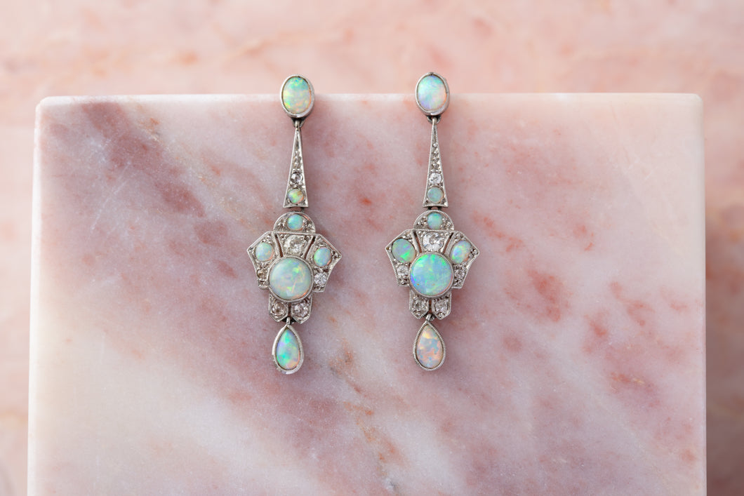 A pair of early 20th diamond and opal ear pendants