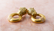 Load image into Gallery viewer, A pair of gold and diamond earclips by Gay Freres.
